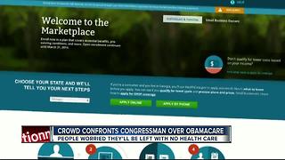 Crowd confronts congressman over Obamacare