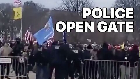 Law Enforcement Officer Opens Gate, Signaling Protesters To Walk Through To The Capitol Jan.6th