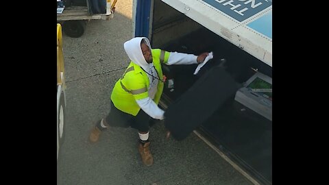 Caught! Careless baggage handlers at Seattle-Tacoma International Airport