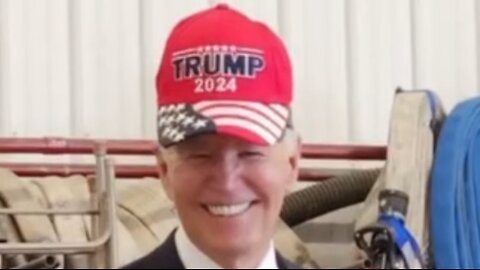 Joe Biden wears Trump hat