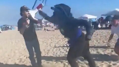 A Furry With A Megaphone Assaults A Man Filming Him On A California Beach