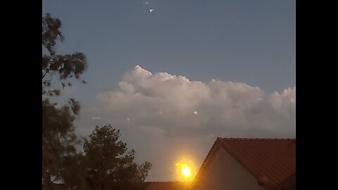 Cloud has moving bright spot which becomes stable. is it a drone or even UAP/UFO. very strange.