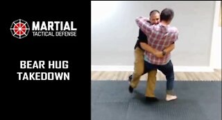 Bear hug trip takedown pin