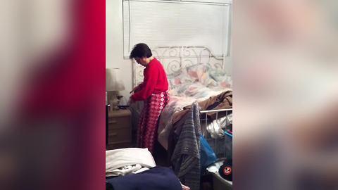 A Woman Freaks Out By A Man Hiding In Her Sheets