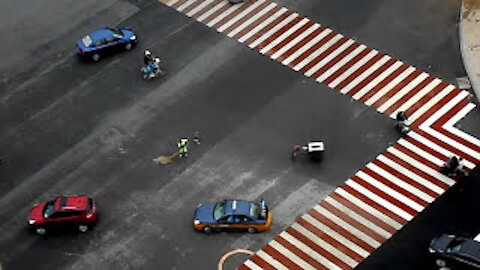 Chinese Street Sweeper in Traffic