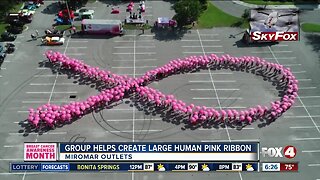 Group helps create large human pink ribbon in Estero