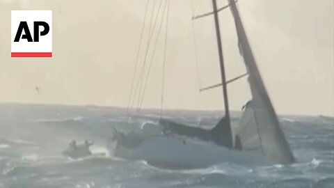 Watch the rescue of two people from a disabled yacht off Australia coast