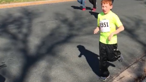 A Little Boy Stops To Hug His Mom During A Race