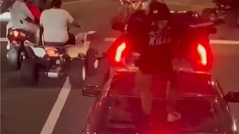 Punk Motorcyclist Jumps On Car And Smashes Rear Window With Child Inside In Philly