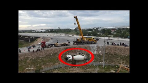 Incredible recovery! Cement mixer truck accident fail overturn from road lifting by crane