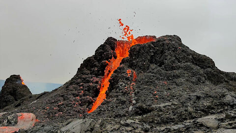 Iceland volcano erupts behind volleyball game