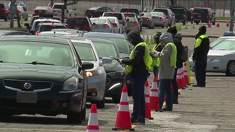 A long line of cars waited to get into Cleveland's municipal lot to pick up food from the Greater Cleveland Food Bank.