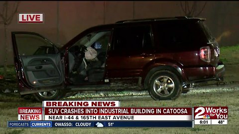 SUV crashes into industrial building in Catoosa