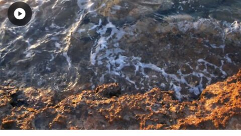 Breaking wave hitting shore, aerial slow motion