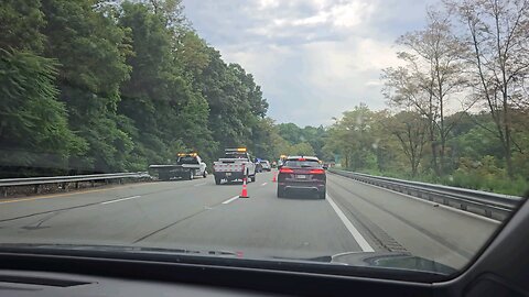 Crash on I-80 E Knowlton.A truck crossed the barrier from the far left and entered the wooded area.