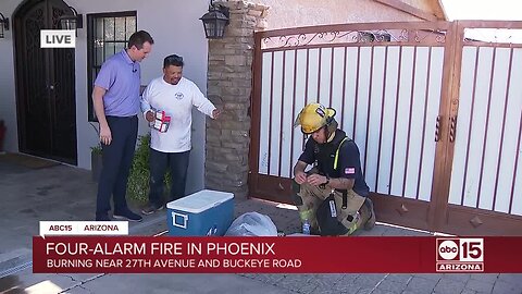 Neighbors provide water to firefighters battling large fire near downtown Phoenix