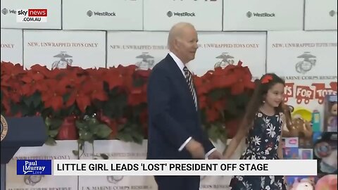 Little girl leads Joe Biden off stage at an event