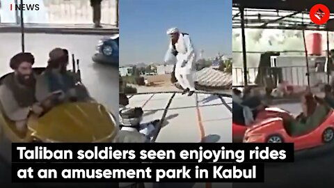 Taliban men enjoy rides at amusement park after capturing Afghanistan