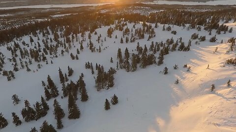 Drone Shoot Of Sunset Over Snowy Winter Landscape