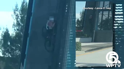 Video shows bicyclist cling to North Palm Beach bridge as it rises