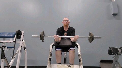 Straight barbell preacher curl 65 lbs 8 reps.