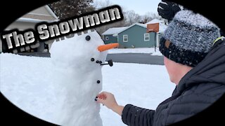 A Snowman takes shape in the front yard