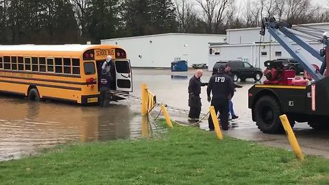 Indy firefighters rescue students from back of school bus stuck in deep water