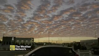 Clouds scattered across the sky at dusk