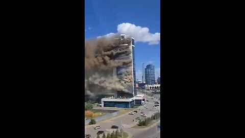 Massive fire - large plumes of smoke rise from multi-story apartment building on fire in the Esil