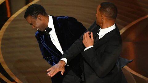 Watch the uncensored moment Will Smith smacks Chris Rock on stage at the Oscars, drops F-bomb