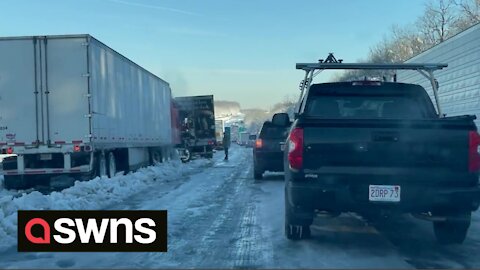 Moment motorist in Virginia is freed after being stranded on I-95 for THIRTEEN HOURS