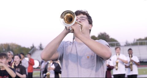 Okemos marching band hopes to "pack the stands" for one last performance