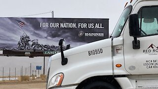 Behind the truck load at a bottled water plant.