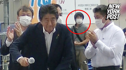 Shinzo Abe's suspected assassin pictured behind him before killing