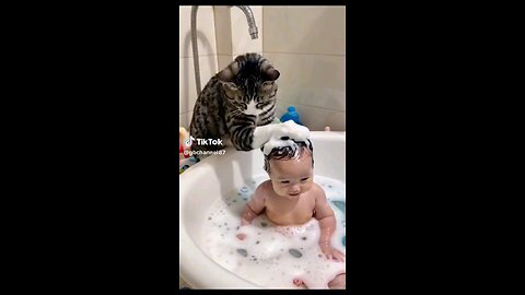 Title: "Purr-fect Bath Time" Video Description (VD): "Watch as an adorable cat helps a baby enjoy