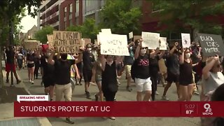 College students hold peaceful march around UC