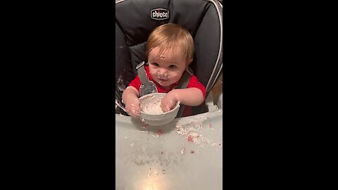 Do you think this baby likes yogurt?