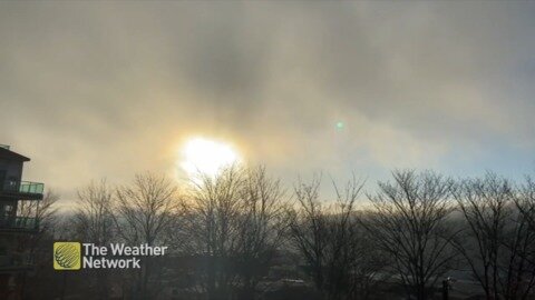 Golden haze of sunlight peeking through the clouds