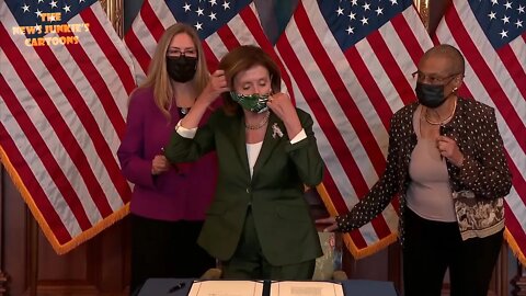 Pelosi masks up for photo op in awkward moment.