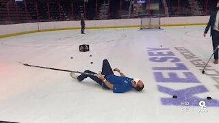 Sports Anchor Caleb Noe tries to play hockey, slips on ice