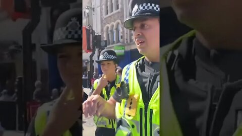 The police removing lesbians from a pride parade.