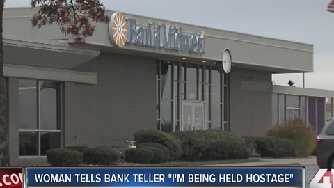 Woman tells bank teller âIâm being held hostageâ