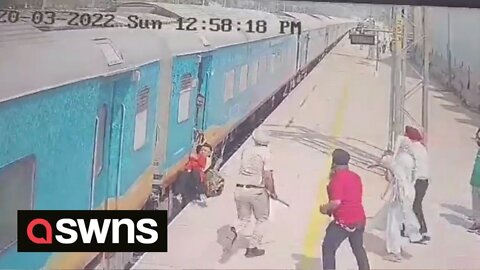 Moment quick-thinking guard saves man who got dragged along by MOVING TRAIN