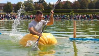 Man uses pumpkin as canoe!