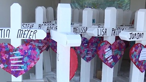 Man sets up crosses at welcome sign ahead of 1 October anniversary