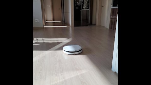 White robot vacuum cleaner