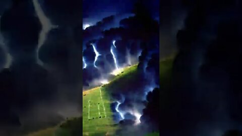 a thunderstorm brewing over an open field, with bolts of lightning flashing in the sky...animation