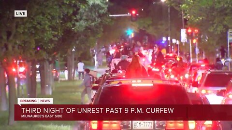 Protesters drive west occupying all four lanes of traffic on Kenwood in Milwaukee