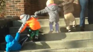 Children fall from steps like dominoes