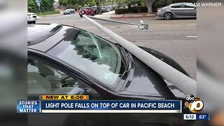 Light pole crashes on top of car in Pacific Beach